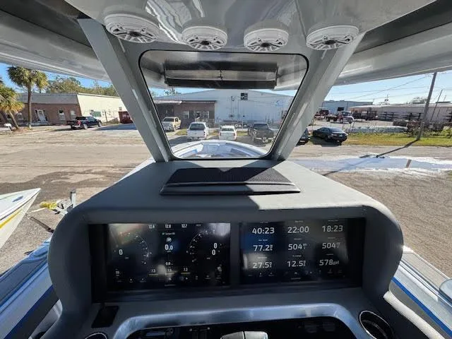 Slide: The Image of Dashboard view of 2025 Statement 380 Open boat with digital displays and controls. - 4