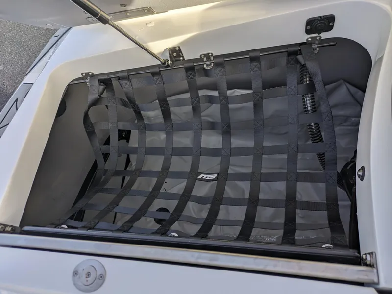 Slide: The Image of 2025 MB B52-23 Alpha storage compartment with secure netting. - 12