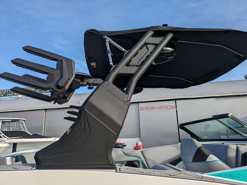 Slide: The Image of 2025 MB B52-23 Alpha boat with sleek wakeboard tower in showroom. - 18