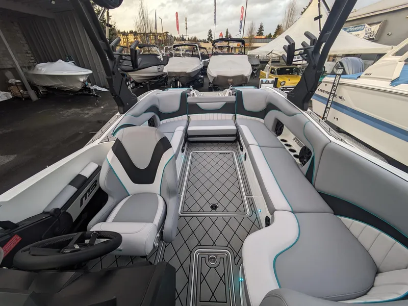 Slide: The Image of 2025 MB B52-23 Alpha boat interior with modern seating and sleek design. - 19