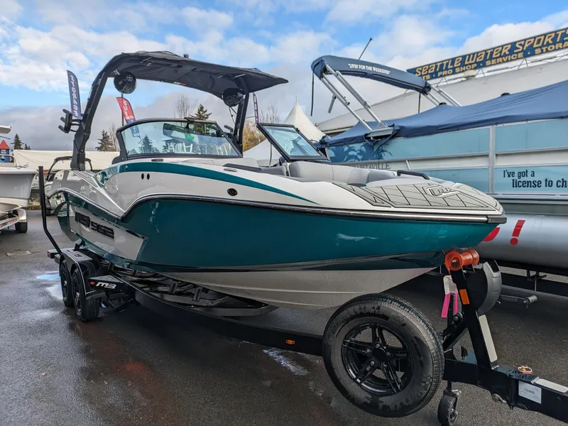 Slide: The Image of 2025 MB B52-23 Alpha boat on trailer at outdoor show. - 2
