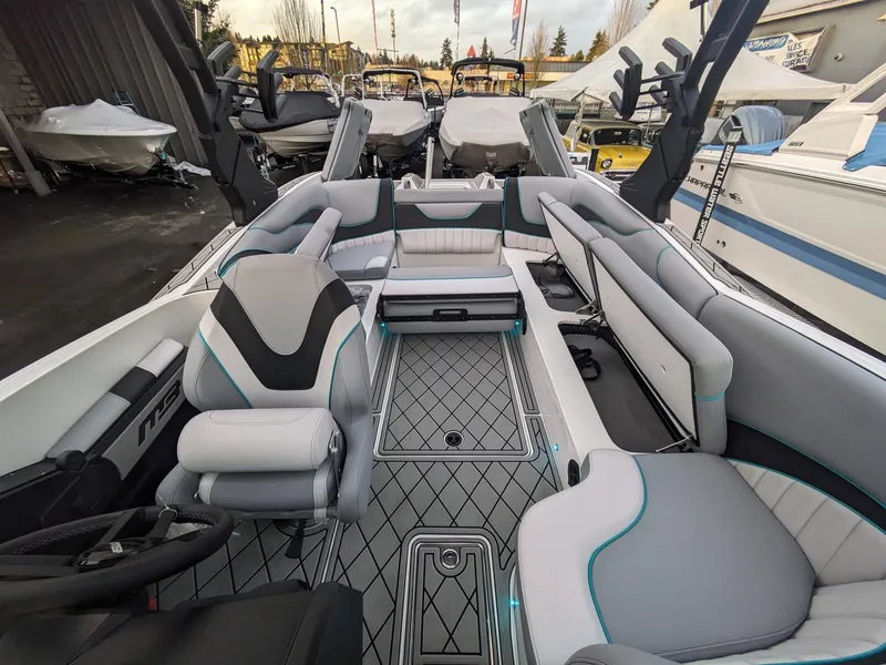 Slide: The Image of 2025 MB B52-23 Alpha boat interior with modern seating and sleek design. - 20