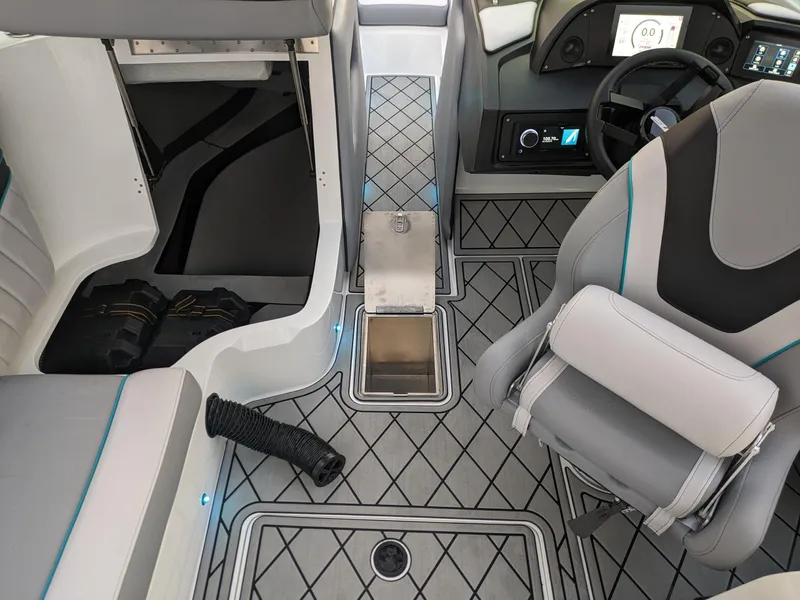 Slide: The Image of 2025 MB B52-23 Alpha boat interior with modern seating and dashboard design. - 26