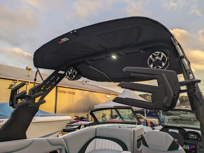 Slide: The Image of 2025 MB B52-23 Alpha boat interior with speakers and wakeboard rack. - 32