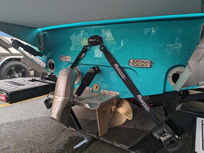 Slide: The Image of 2025 MB B52-23 Alpha boat stern with propeller and trim tabs. - 33