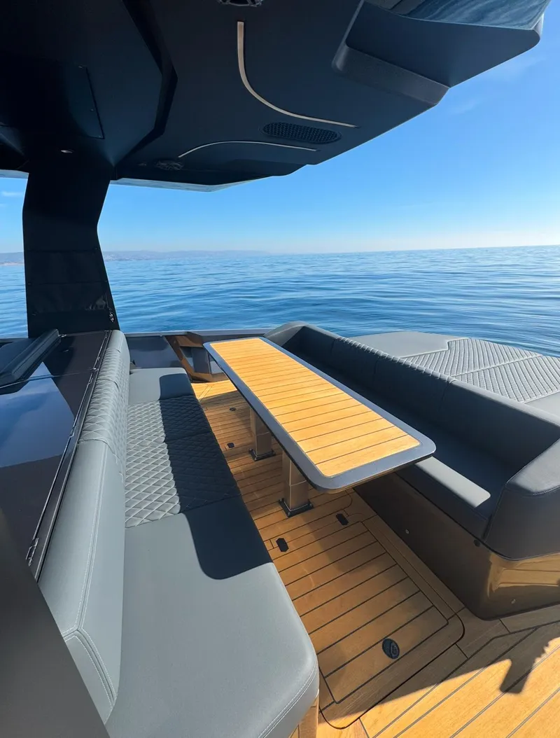 Slide: The Image of Luxurious 2019 Maori 54ft Family yacht interior with sleek seating and ocean view. - 10