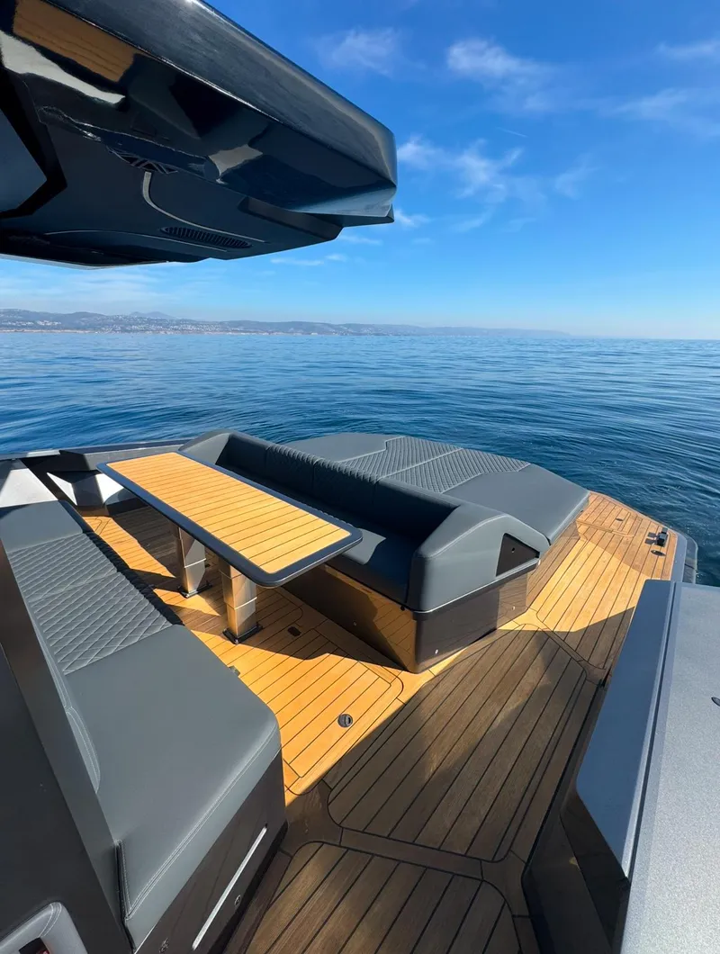 Slide: The Image of Luxurious 2019 Maori 54ft Family yacht with sleek deck and seating, cruising on calm waters. - 13