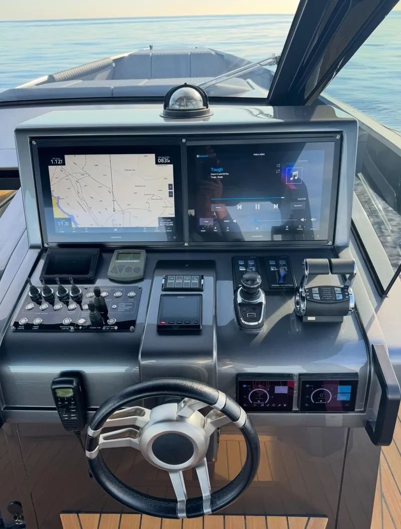 Slide: The Image of 2019 Maori 54ft Family yacht helm with dual navigation screens and modern controls. - 15
