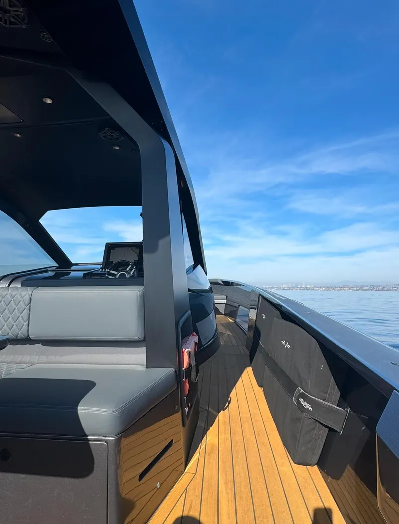 Slide: The Image of 2019 Maori 54ft Family yacht with sleek design and spacious deck on open water. - 5