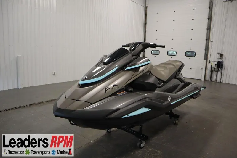 The Image of 2025 Yamaha WaveRunner FX® HO Audio in showroom, sleek design, gray and blue accents. - 0