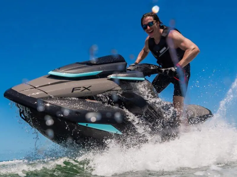 Slide: The Image of 2025 Yamaha WaveRunner FX® HO Audio jet ski riding on ocean waves. - 23