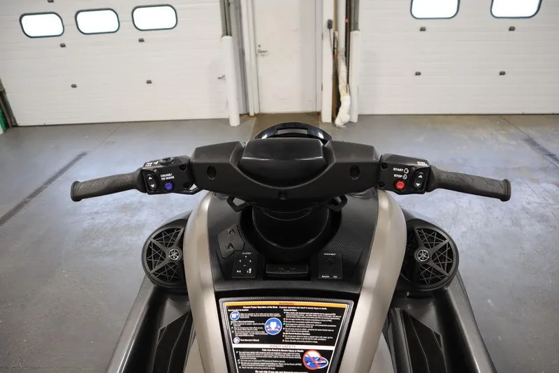 Slide: The Image of 2025 Yamaha WaveRunner FX® HO Audio handlebars and controls in a garage setting. - 9