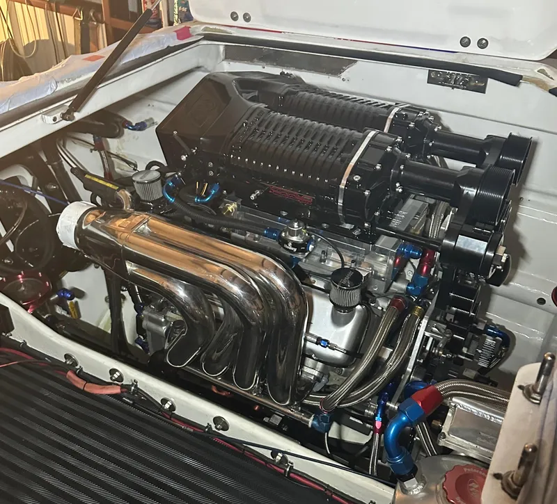 Slide: The Image of High-performance engine of a 1999 Skater 32 Skater boat, showcasing intricate components. - 19