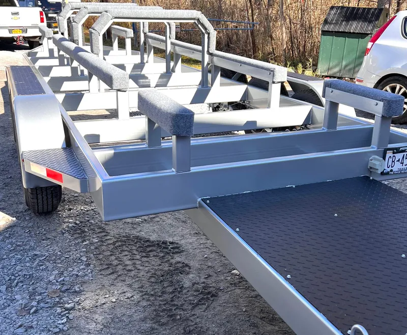 Slide: The Image of 1999 Skater 32 boat trailer, sturdy metal frame, parked outdoors. - 21