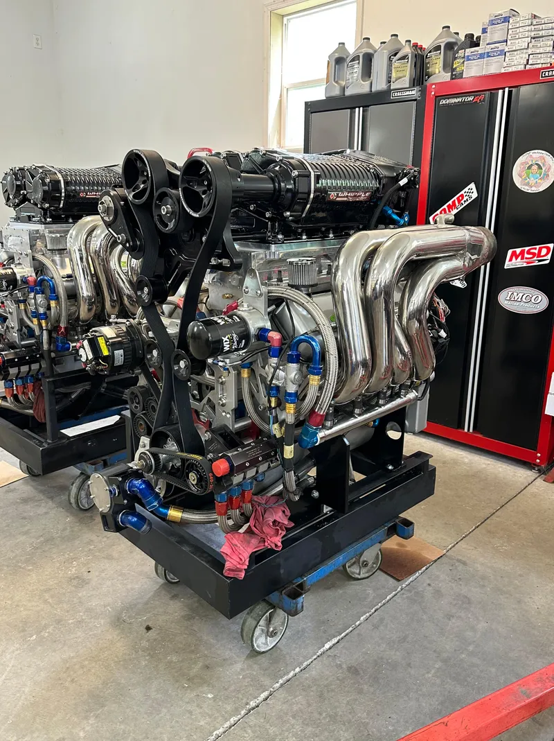 Slide: The Image of High-performance engine for 1999 Skater 32 Skater boat in a workshop setting. - 24