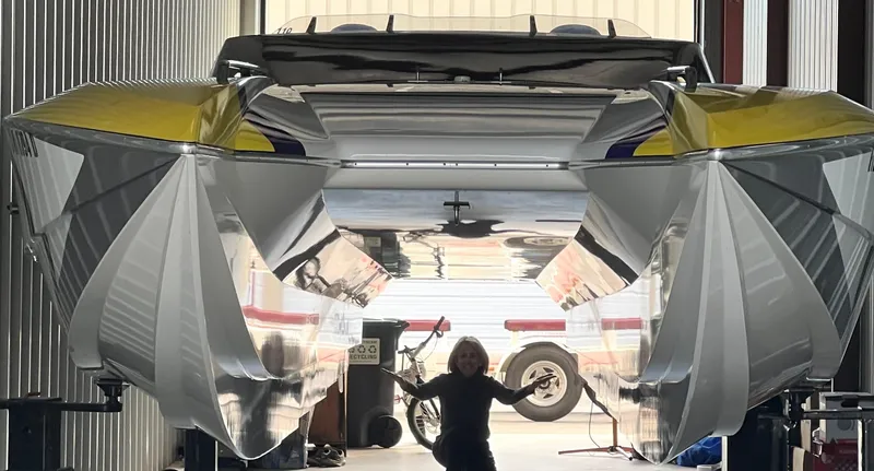 Slide: The Image of 1999 Skater 32 powerboat in a garage, with a person standing underneath. - 5