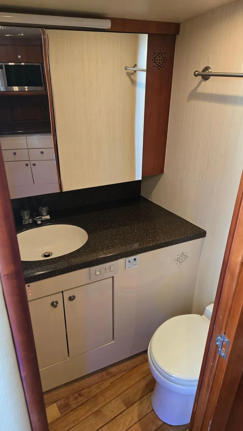 Slide: The Image of Bathroom interior of 2008 Ocean Yachts 37 Billfish with sink and toilet. - 25