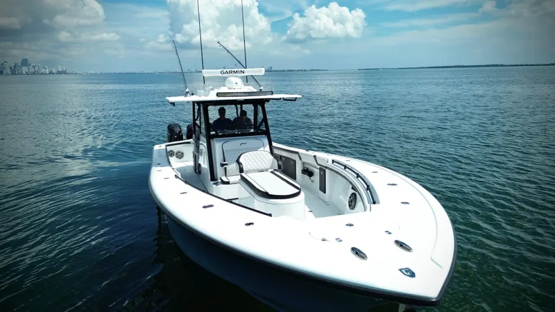 Slide: The Image of 2024 Yellowfin 39 Offshore boat on calm ocean waters under a blue sky. - 12