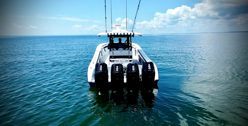 Slide: The Image of 2024 Yellowfin 39 Offshore boat with multiple engines on open water. - 16