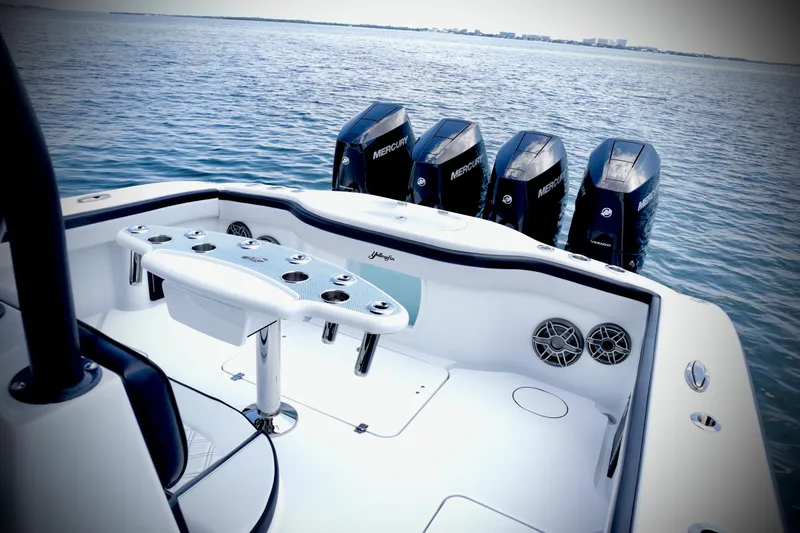 Slide: The Image of 2024 Yellowfin 39 Offshore boat with four Mercury engines on open water. - 18