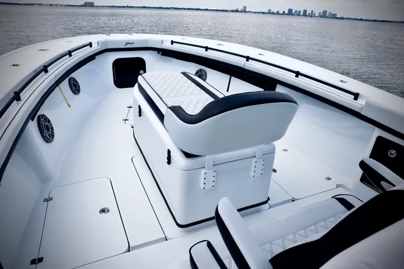 Slide: The Image of 2024 Yellowfin 39 Offshore boat interior with seating, on calm water. - 22