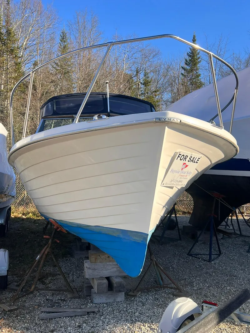 Slide: The Image of 1975 Lyman 26 Cruisette boat for sale, displayed outdoors. - 10