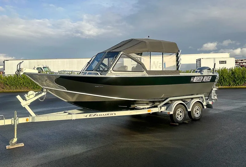 Slide: The Image of 2012 North River 21 SEAHAWK RTF boat on trailer, parked outdoors. - 1