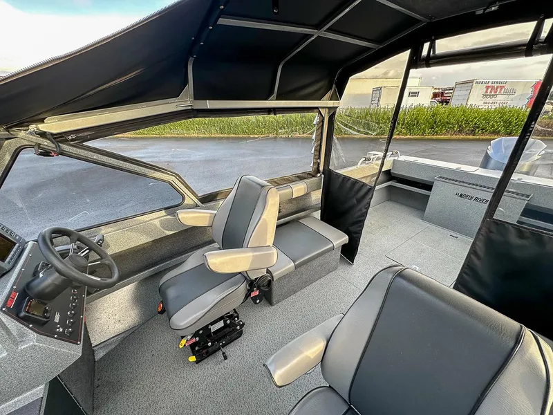 Slide: The Image of Interior of 2012 North River 21 SEAHAWK RTF boat with seating and steering wheel. - 10