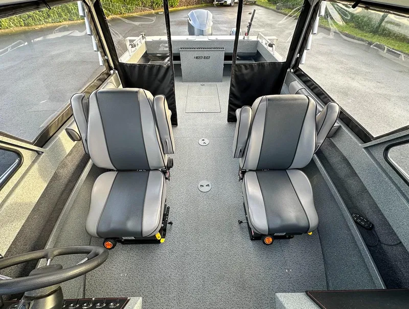 Slide: The Image of Interior of 2012 North River 21 SEAHAWK RTF boat with two gray seats. - 12