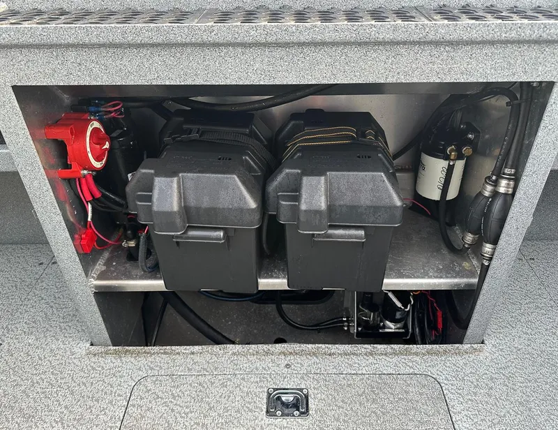Slide: The Image of Battery compartment of 2012 North River 21 SEAHAWK RTF boat, showing dual batteries and wiring. - 14