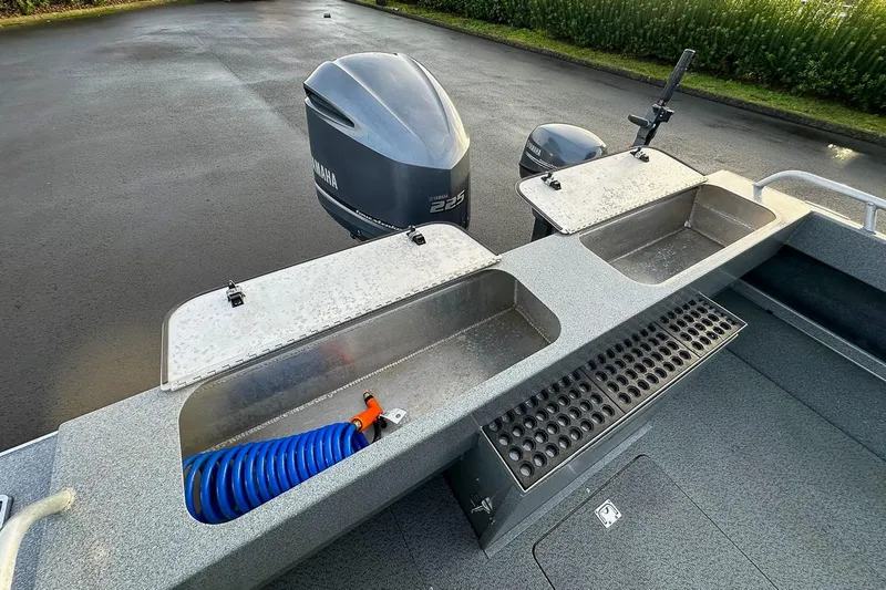 Slide: The Image of 2012 North River 21 SEAHAWK RTF boat with Yamaha outboard motor and fishing setup. - 15