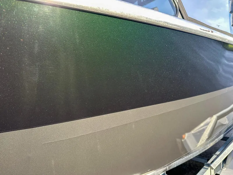 Slide: The Image of Close-up of 2012 North River 21 SEAHAWK RTF boat hull with metallic finish. - 16