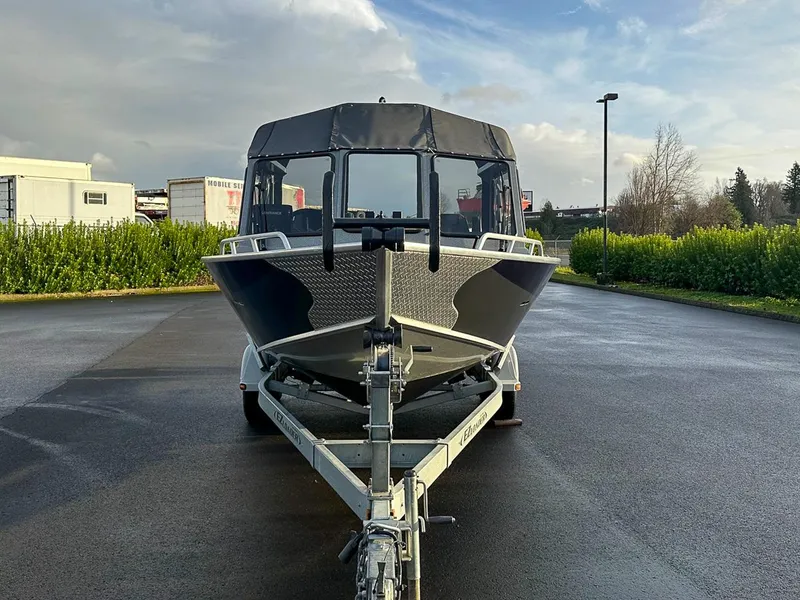 Slide: The Image of 2012 North River 21 SEAHAWK RTF boat on trailer, parked outdoors. - 6