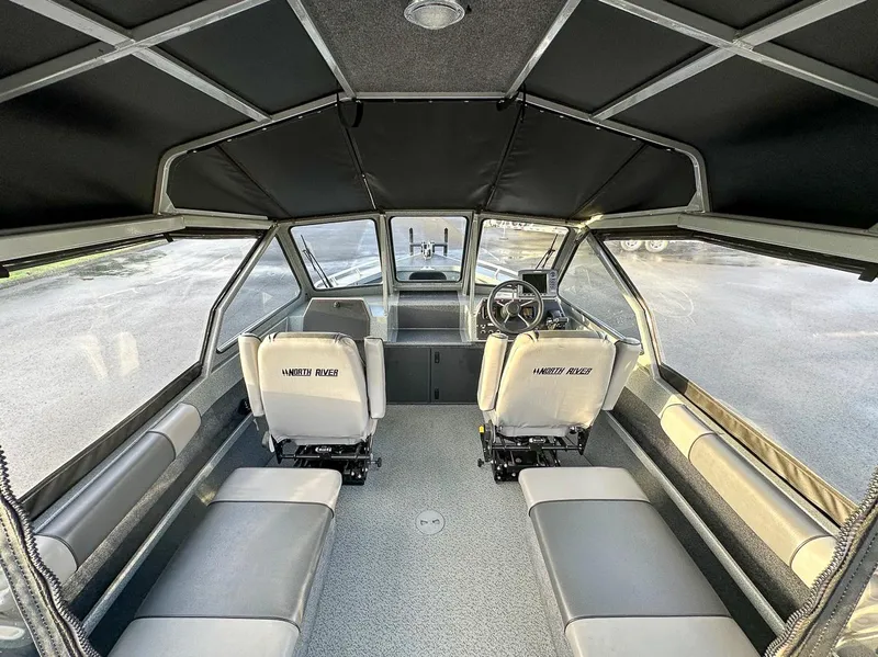 Slide: The Image of Interior of 2012 North River 21 SEAHAWK RTF boat with seating and steering console. - 7
