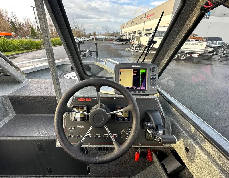 Slide: The Image of Interior view of 2012 North River 21 SEAHAWK RTF boat with steering wheel and navigation system. - 8