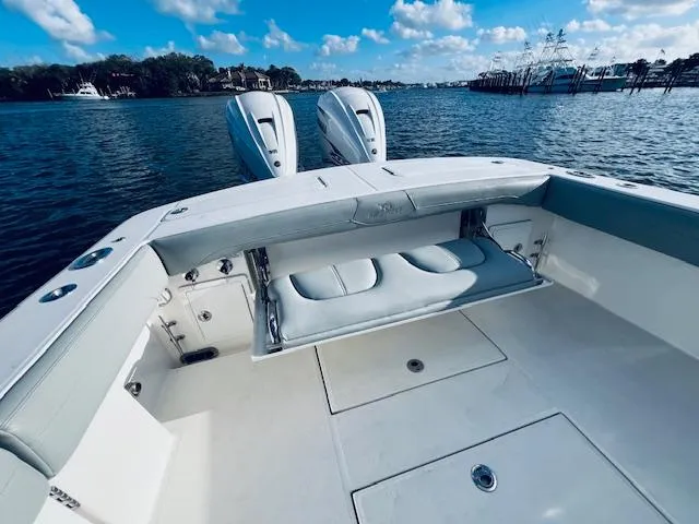 Slide: The Image of 2021 Regulator 34 boat with dual engines on a calm water backdrop. - 15