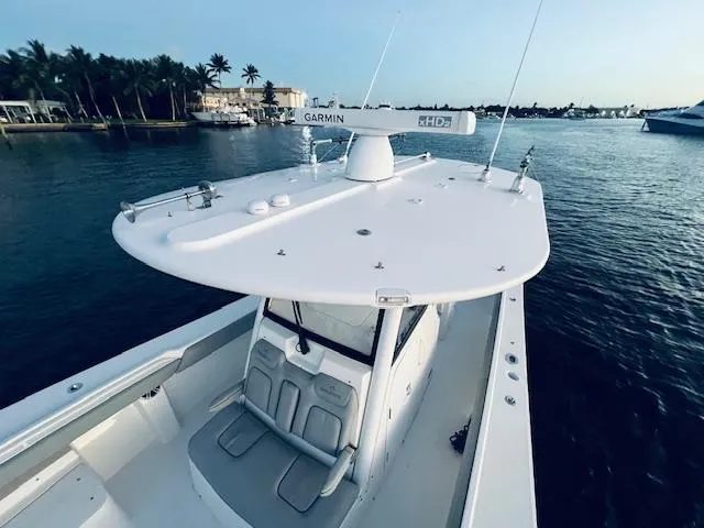 Slide: The Image of 2021 Regulator 34 boat with Garmin radar on calm water. - 29