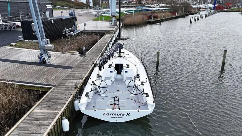 Slide: The Image of X-Yachts XR-41 sailboat docked at marina, 2025 model, named Formula X. - 6