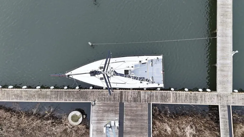 Slide: The Image of Aerial view of 2025 X-Yachts XR-41 docked at a wooden pier. - 8