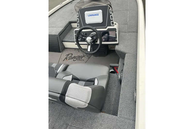 Slide: The Image of Interior of 2025 Ranger ALPHA 208 boat with steering wheel and Lowrance display. - 86