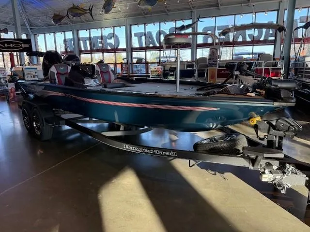 The Image of 2025 Ranger ALPHA 208 boat displayed in a showroom with trailer. - 0