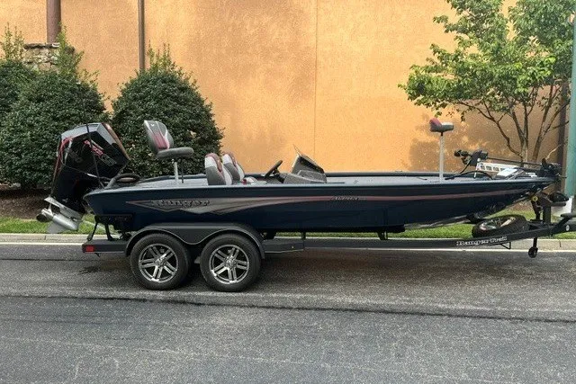 The Image of 2025 Ranger ALPHA 208 fishing boat on trailer, parked outdoors. - 0