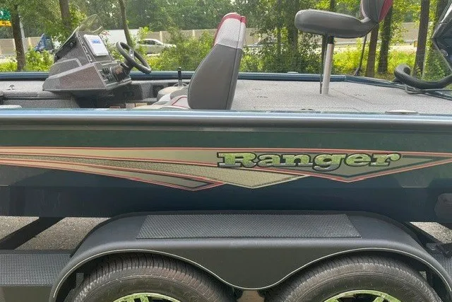Slide: The Image of 2025 Ranger ALPHA 208 boat, side view, featuring sleek design and dual wheels. - 11