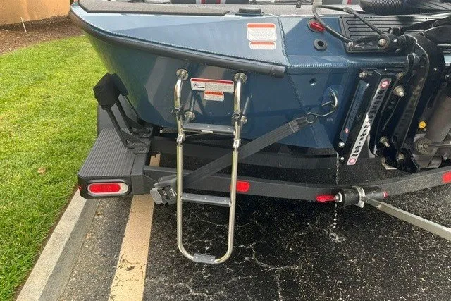 Slide: The Image of Rear view of 2025 Ranger ALPHA 208 boat with ladder and trailer. - 7