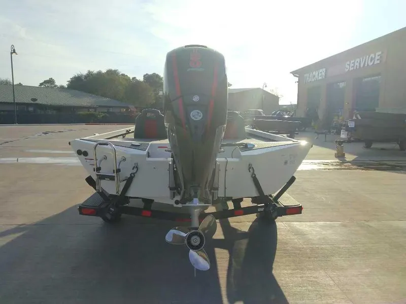 Slide: The Image of 2025 Ranger RT198P boat on trailer outside service center. - 3