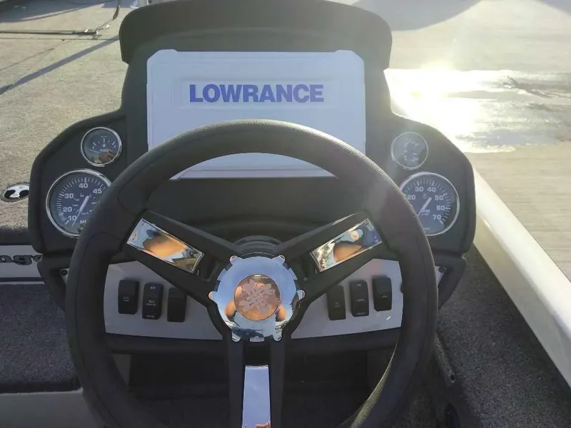 Slide: The Image of 2025 Ranger RT198P boat dashboard with Lowrance display and steering wheel. - 5