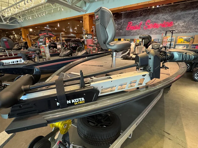 Slide: The Image of 2025 Ranger ALPHA 208 boat with Minn Kota Ultrex motor in showroom. - 2