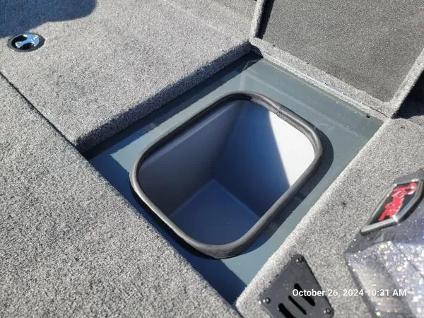 Slide: The Image of 2025 Ranger RT198P boat storage compartment with carpeted interior. - 5