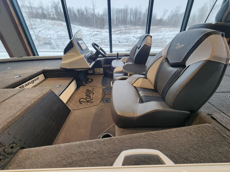 Slide: The Image of Interior of 2025 Ranger ALPHA 208 boat with modern seating and dashboard. - 4