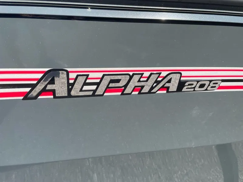 Slide: The Image of Ranger ALPHA 208 logo on gray surface, 2025 model. - 2